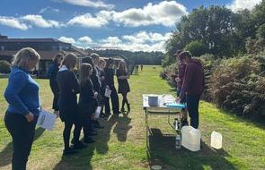 Students at learning station First Green Woburn.JPG