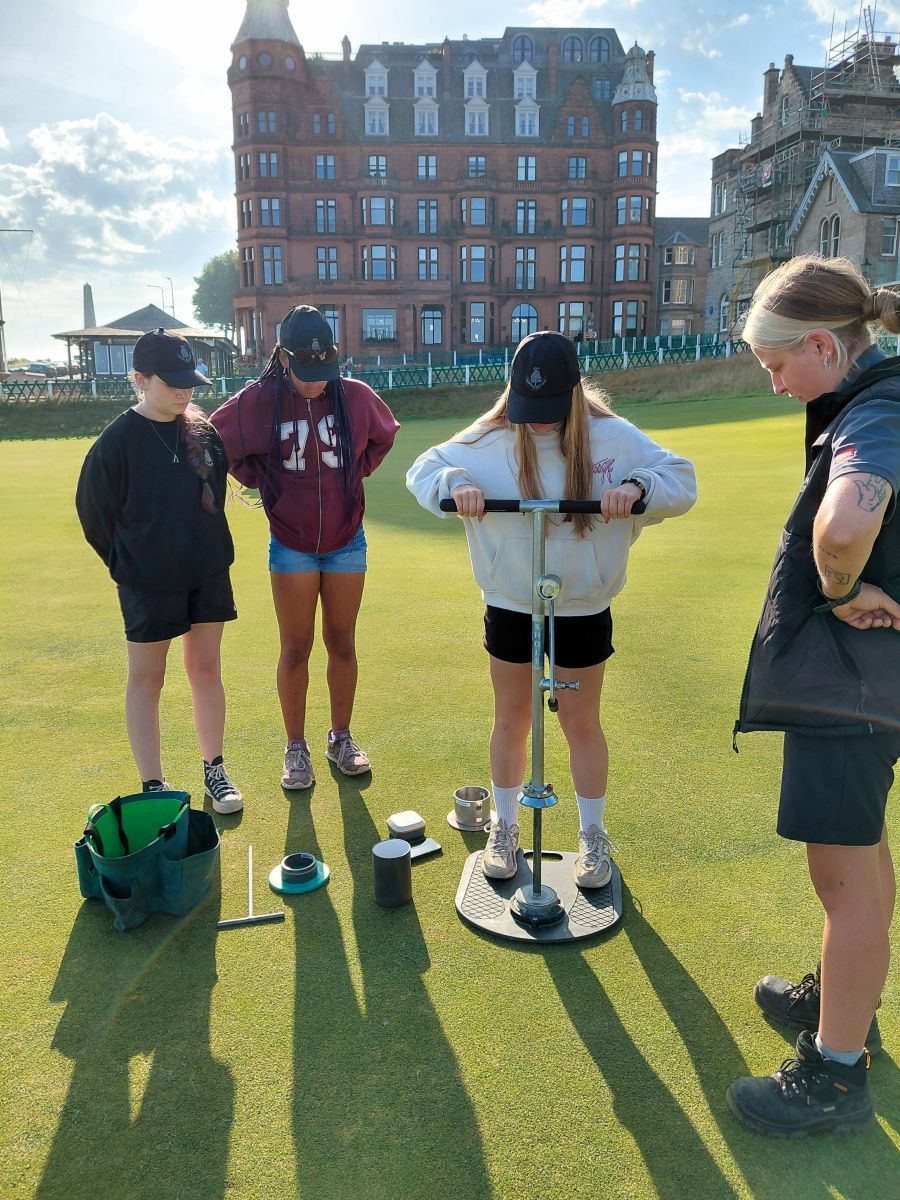 Cutting the 18th hole on the Old Course.jpg