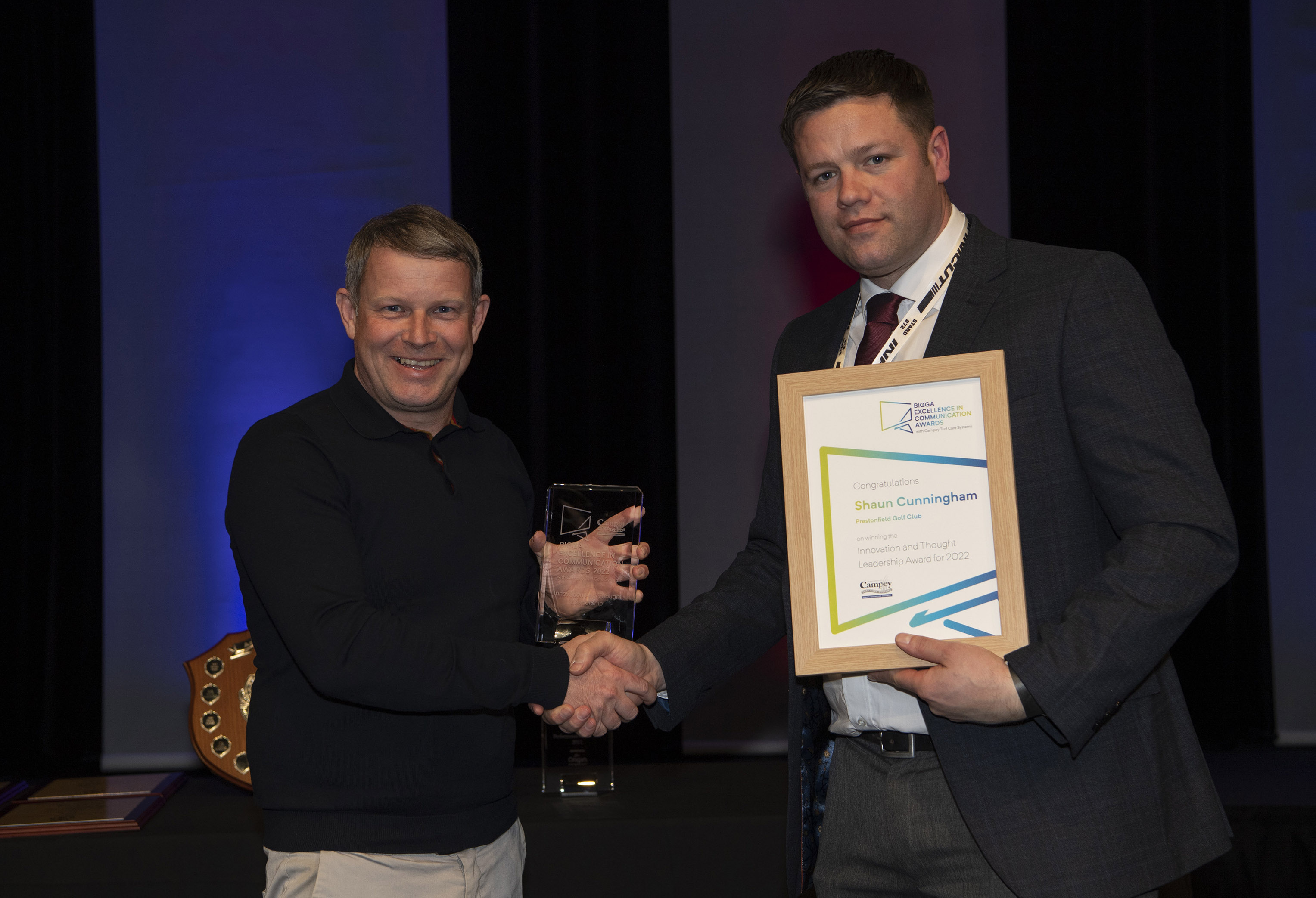 Shaun Cunningham (left) was presented with the Innovation and Thought Leadership Award by Lee Morgado of Campey Turf Care Systems