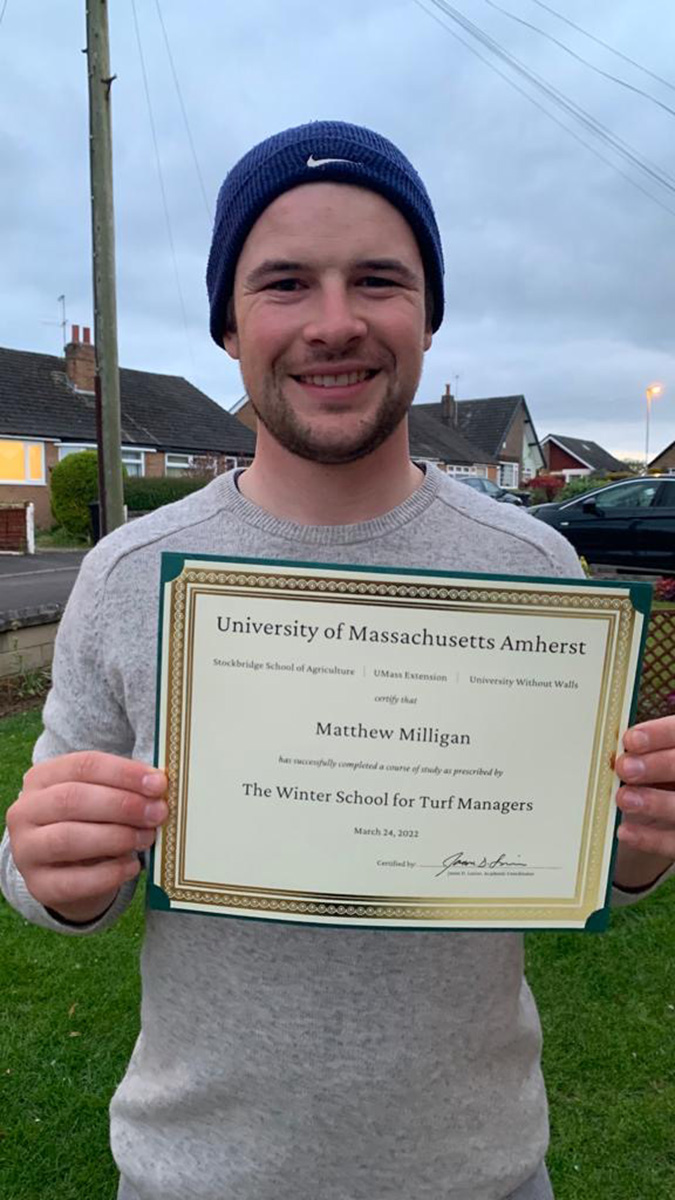 Matt Milligan with his graduation certificate from the University of Massachusetts