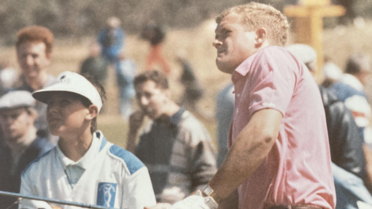 Playing out of the rough as caddie Ryan Dône watches on.jpg