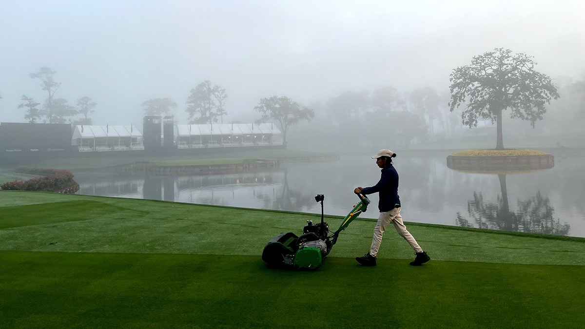 A female TPC Sawgrass staff member mowing the 17th tee 1.jpg