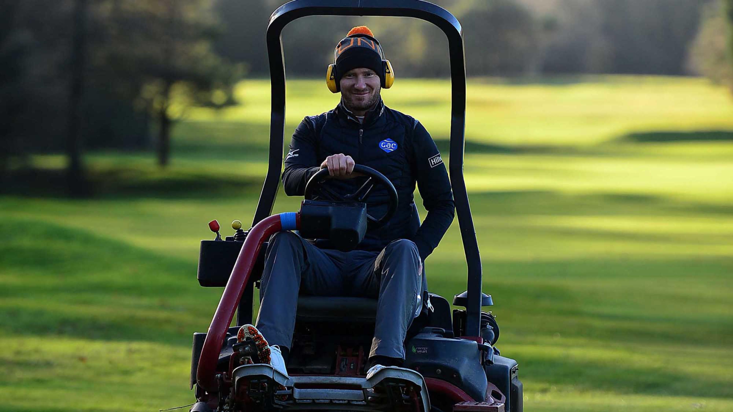 Chris Wood testing out a greens mower.JPG