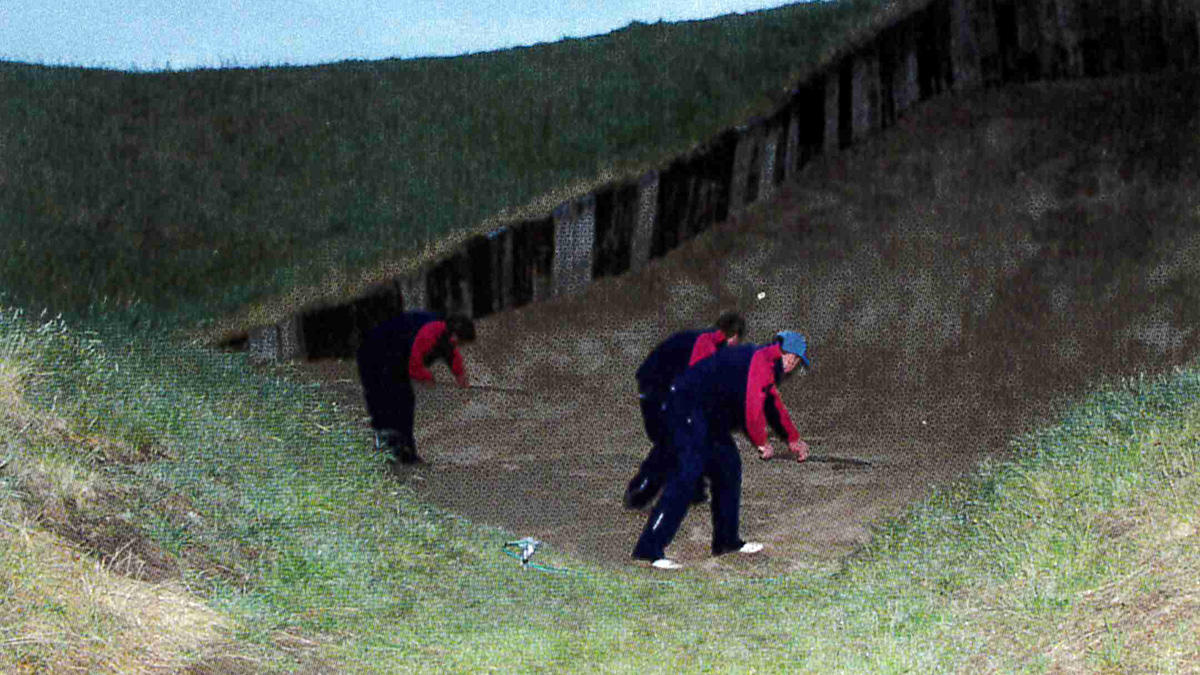 The massive 4th hole bunker gets the support team treatment.jpg